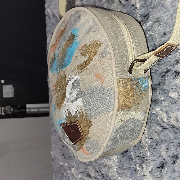 Canvas round crossbody purse. Has splashes of color. - Picture 8 of 10
